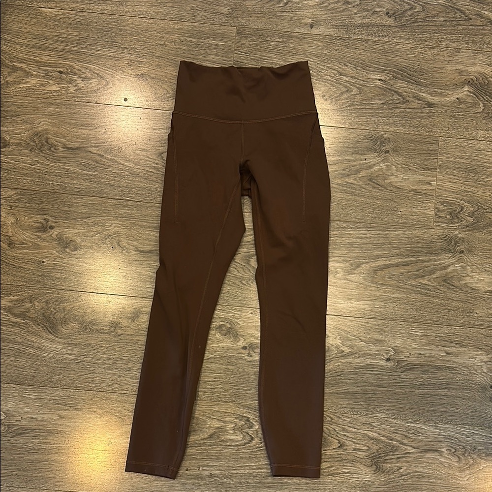 Wunder train high rise tight with pockets 25”